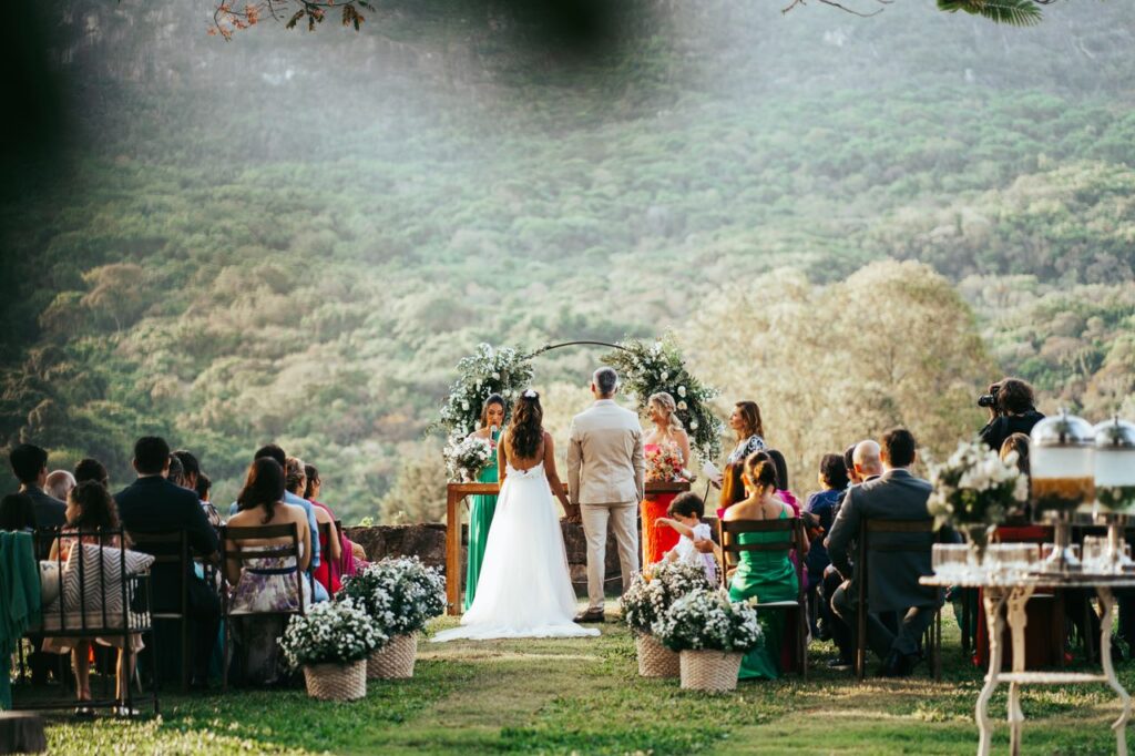 The Art of Drawing Readers In: Your attractive post title goes here Charming outdoor wedding in Tiradentes, Brazil with lush greenery and a scenic backdrop.