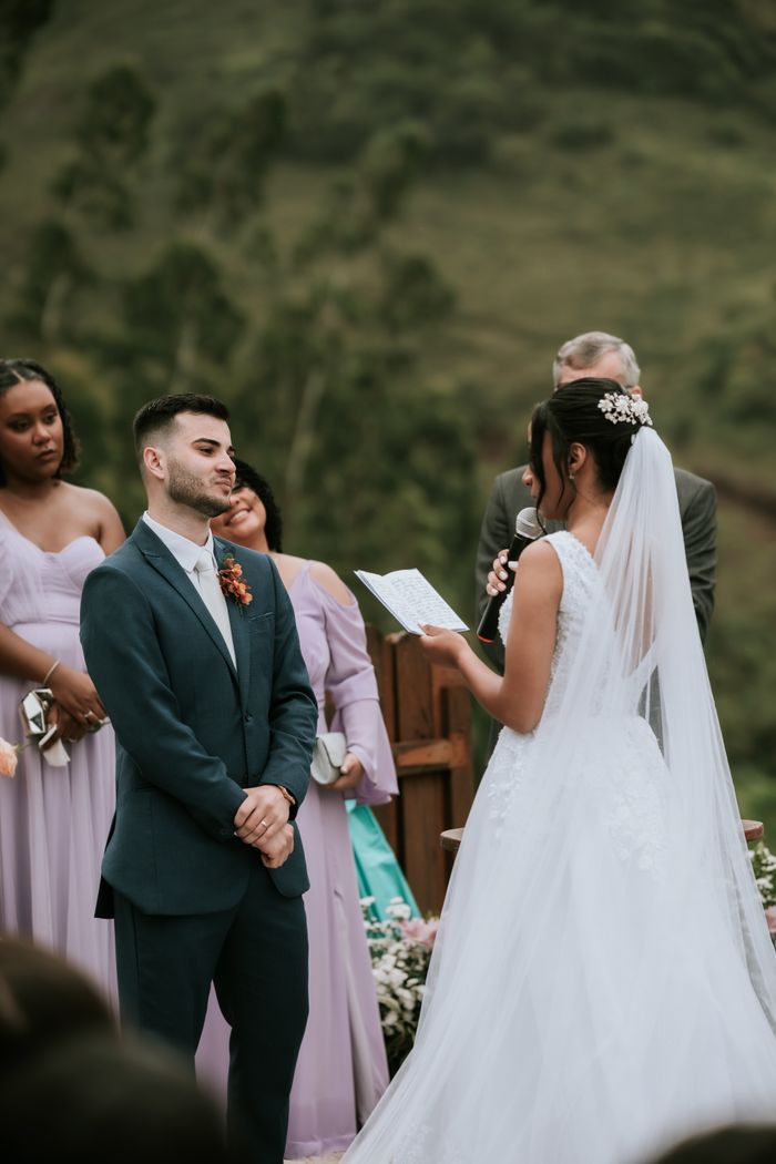Mastering the First Impression: Your intriguing post title goes here Bride and groom exchanging vows at outdoor wedding ceremony, surrounded by bridesmaids.
